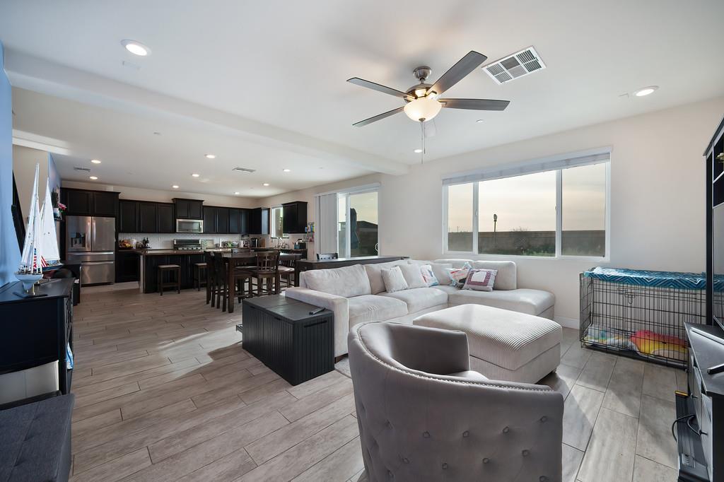 1004 Lavender Street Manteca, CA 95337 - Photo 11 of 35 a living room with furniture and kitchen view