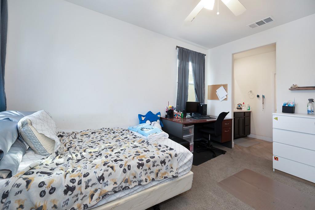 1004 Lavender Street Manteca, CA 95337 - Photo 17 of 35 a bedroom with a bed and a dresser