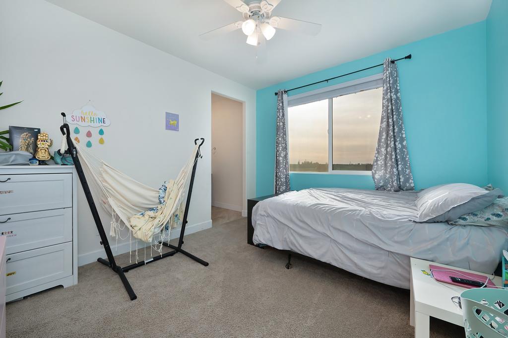 1004 Lavender Street Manteca, CA 95337 - Photo 21 of 35 a bedroom with a bed and a window