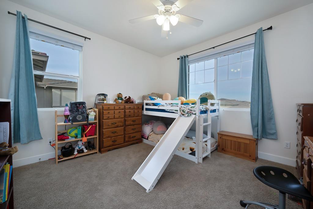 1004 Lavender Street Manteca, CA 95337 - Photo 23 of 35 a bedroom with furniture and a bed