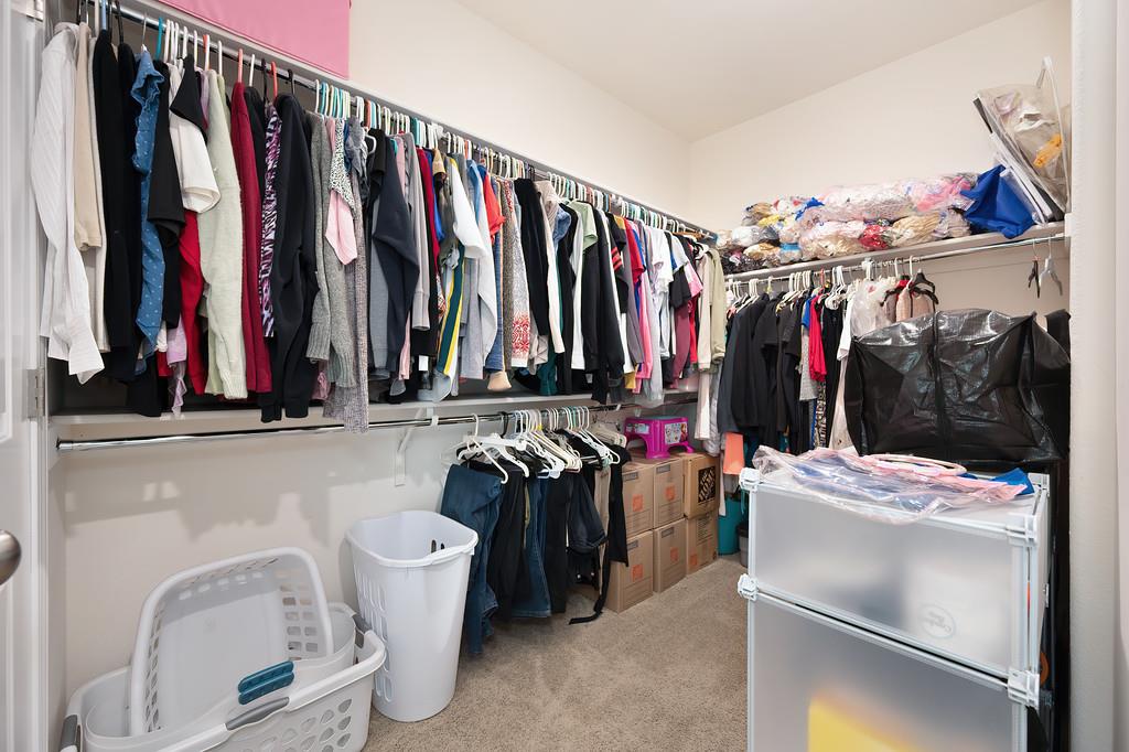 1004 Lavender Street Manteca, CA 95337 - Photo 29 of 35 a view of walk in closet with clothes