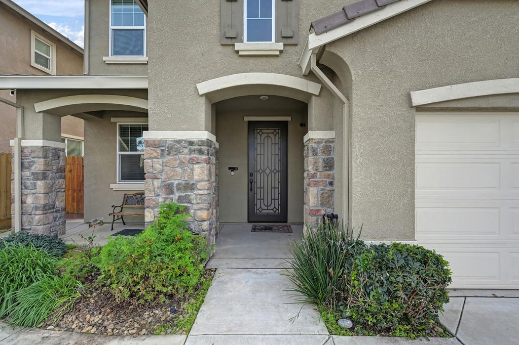 1004 Lavender Street Manteca, CA 95337 - Photo 3 of 35 a front view of a house with garden