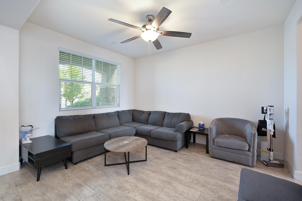 1004 Lavender Street Manteca, CA 95337 - Photo 4 of 35 a living room with furniture and a window