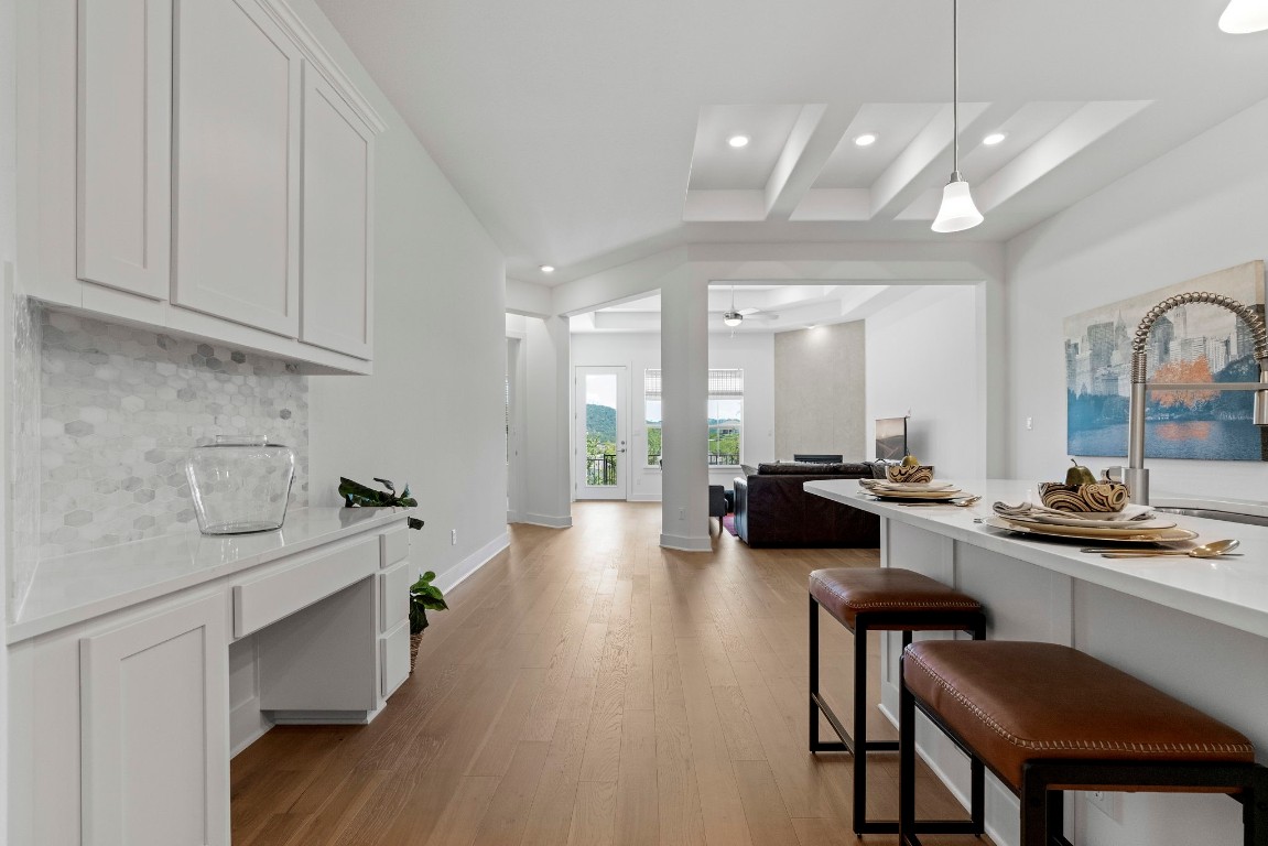 307 Cartwheel Bend Austin, TX 78738 - Photo 17 of 38 a large kitchen with a table and chairs