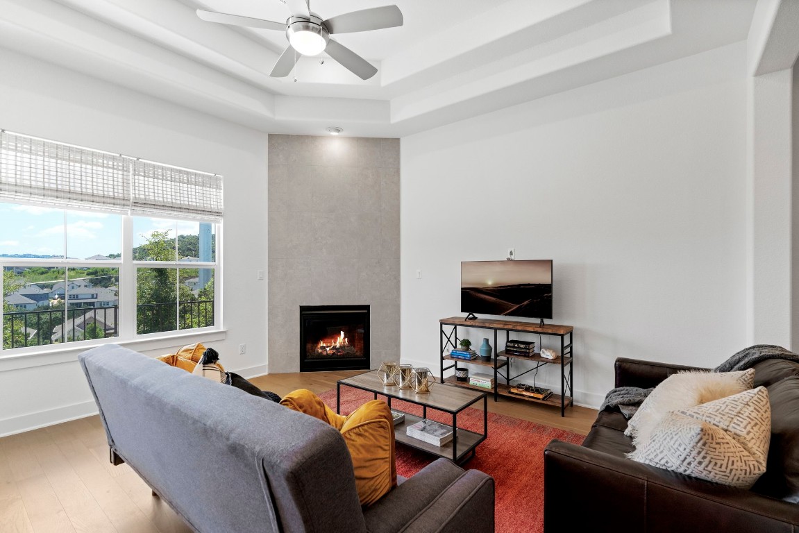 307 Cartwheel Bend Austin, TX 78738 - Photo 18 of 38 a living room with furniture and a fireplace
