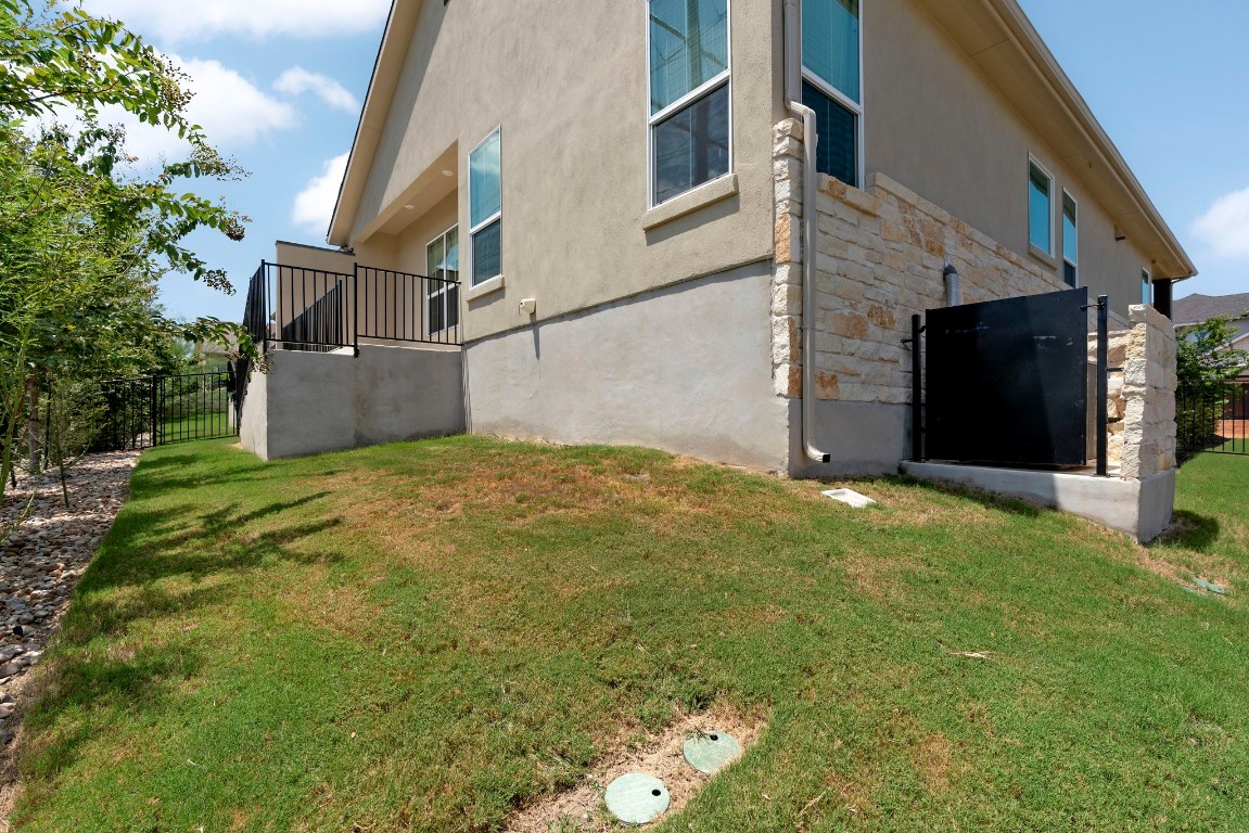 307 Cartwheel Bend Austin, TX 78738 - Photo 28 of 38 a view of a house with a yard