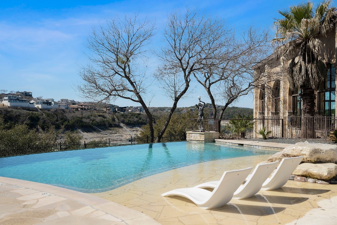307 Cartwheel Bend Austin, TX 78738 - Photo 33 of 38 a view of a swimming pool with a patio