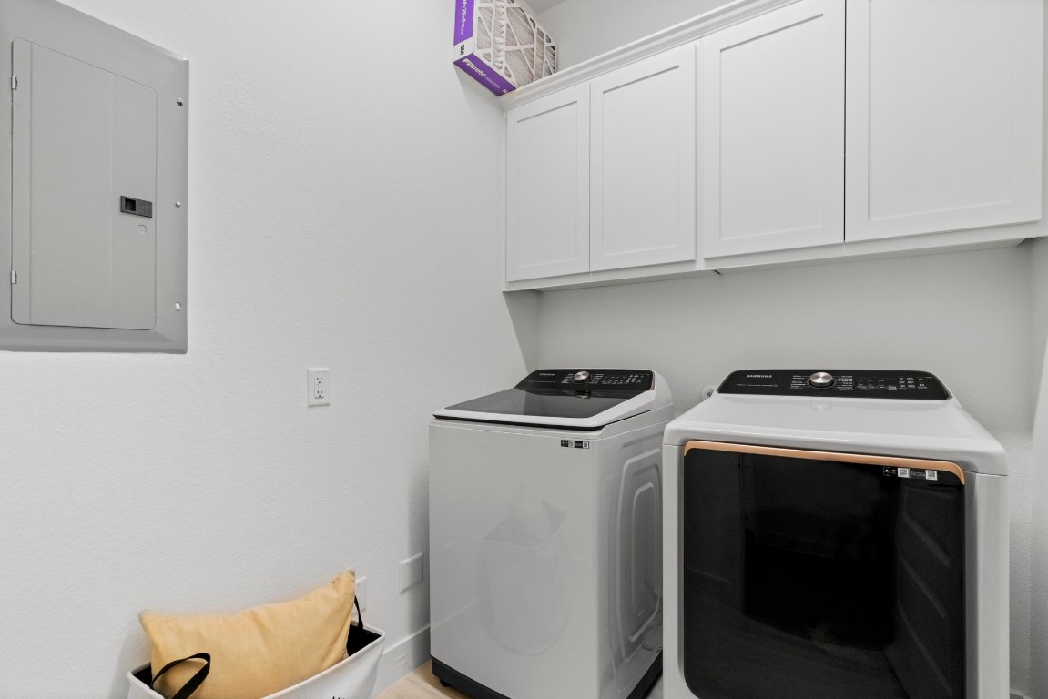 307 Cartwheel Bend Austin, TX 78738 - Photo 8 of 38 a view of storage and utility room with washer and dryer
