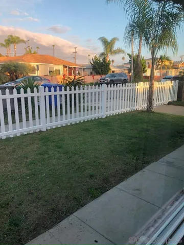 a view of a house with backyard and porch