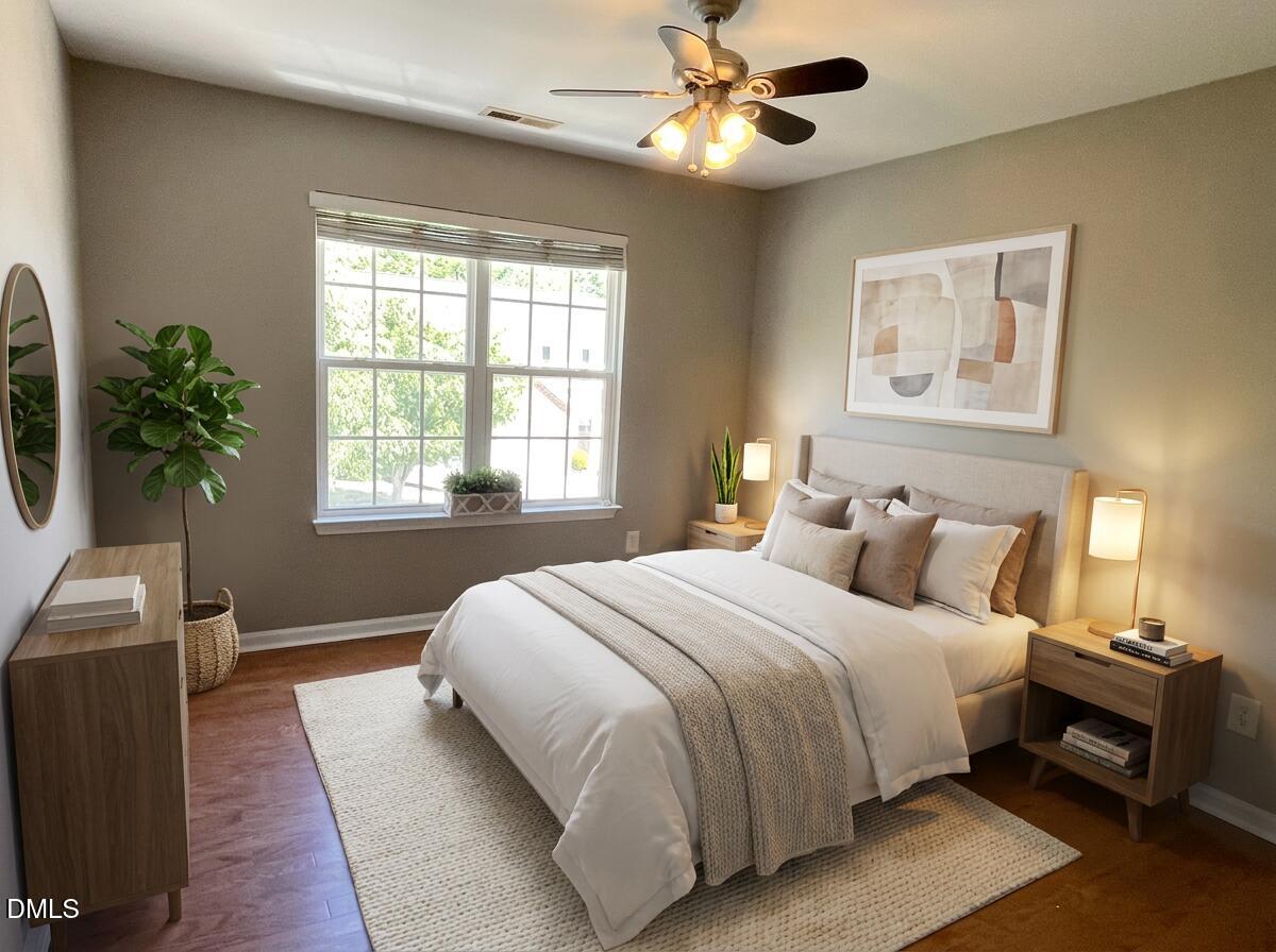 3531 Oneonta Avenue Raleigh, NC 27604 - Photo 9 of 22 a bedroom with a large bed and a chandelier