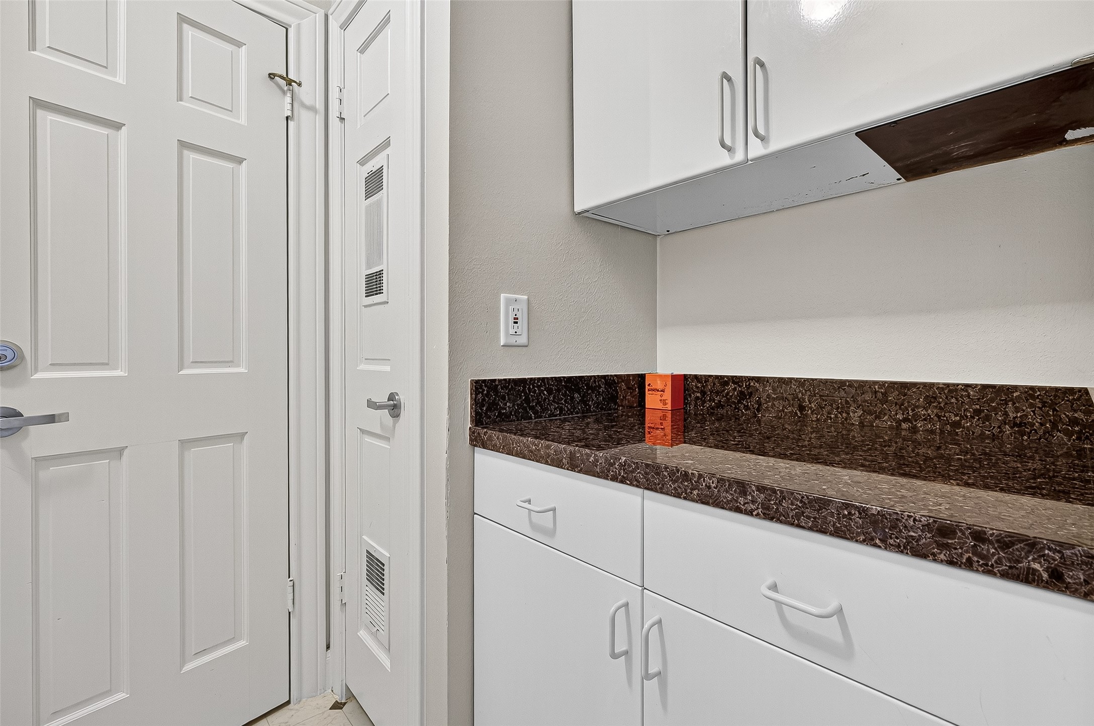 3027 Bissonnet Street Houston, TX 77005 - Photo 25 of 47 Built-in cabinetry with granite accents — thoughtful storage already in place