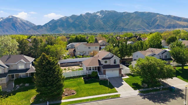 11189 Ohenry Road East Sandy, UT 84070 - Photo 35 of 44 Residential property featuring a two-story design with a light gray exterior, white trim, and a prominent front porch