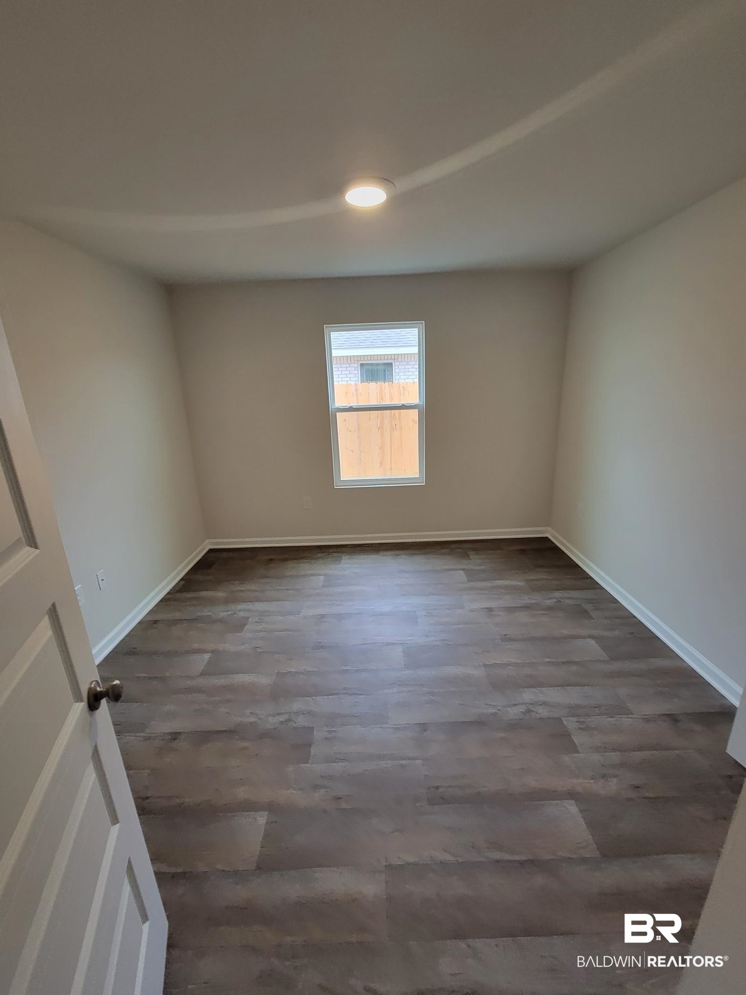 24625 Ponder Loop Loxley, AL 36551 - Photo 11 of 30 Empty room with dark hardwood / wood-style floors