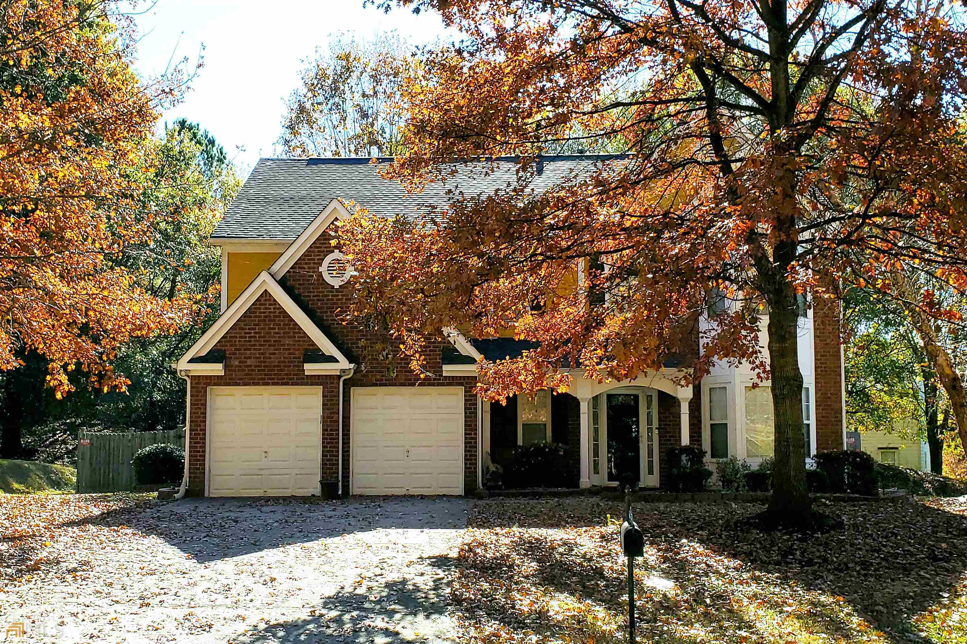 355 Magnolia Walk Lane Atlanta, GA 30349 - Photo 1 of 1 a front view of a house with a yard