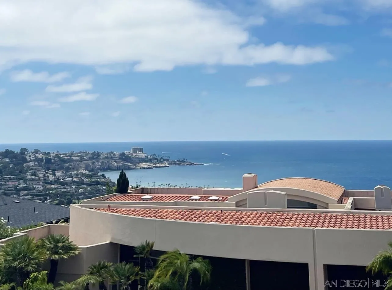 a view of a city with an ocean