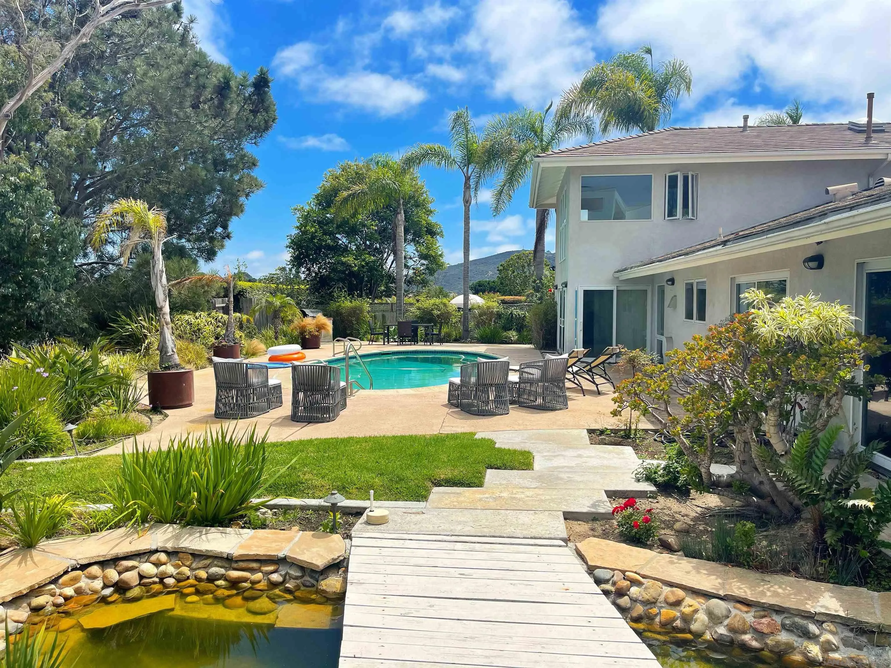 8283 Prestwick Drive La Jolla, CA 92037 - Photo 2 of 2 a view of a house with sitting area and garden