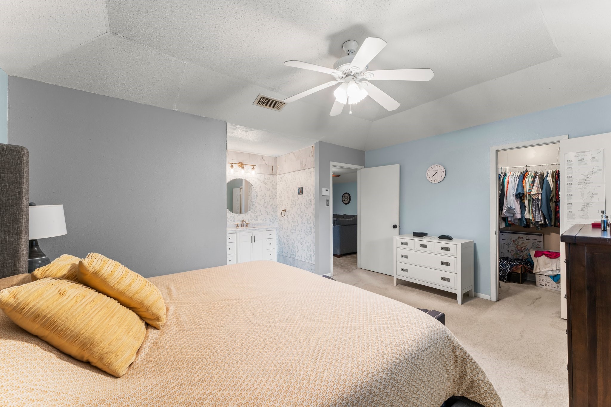 6103 Sunnygate Drive Spring, TX 77373 - Photo 13 of 25 a bedroom with a bed and a walk in closet