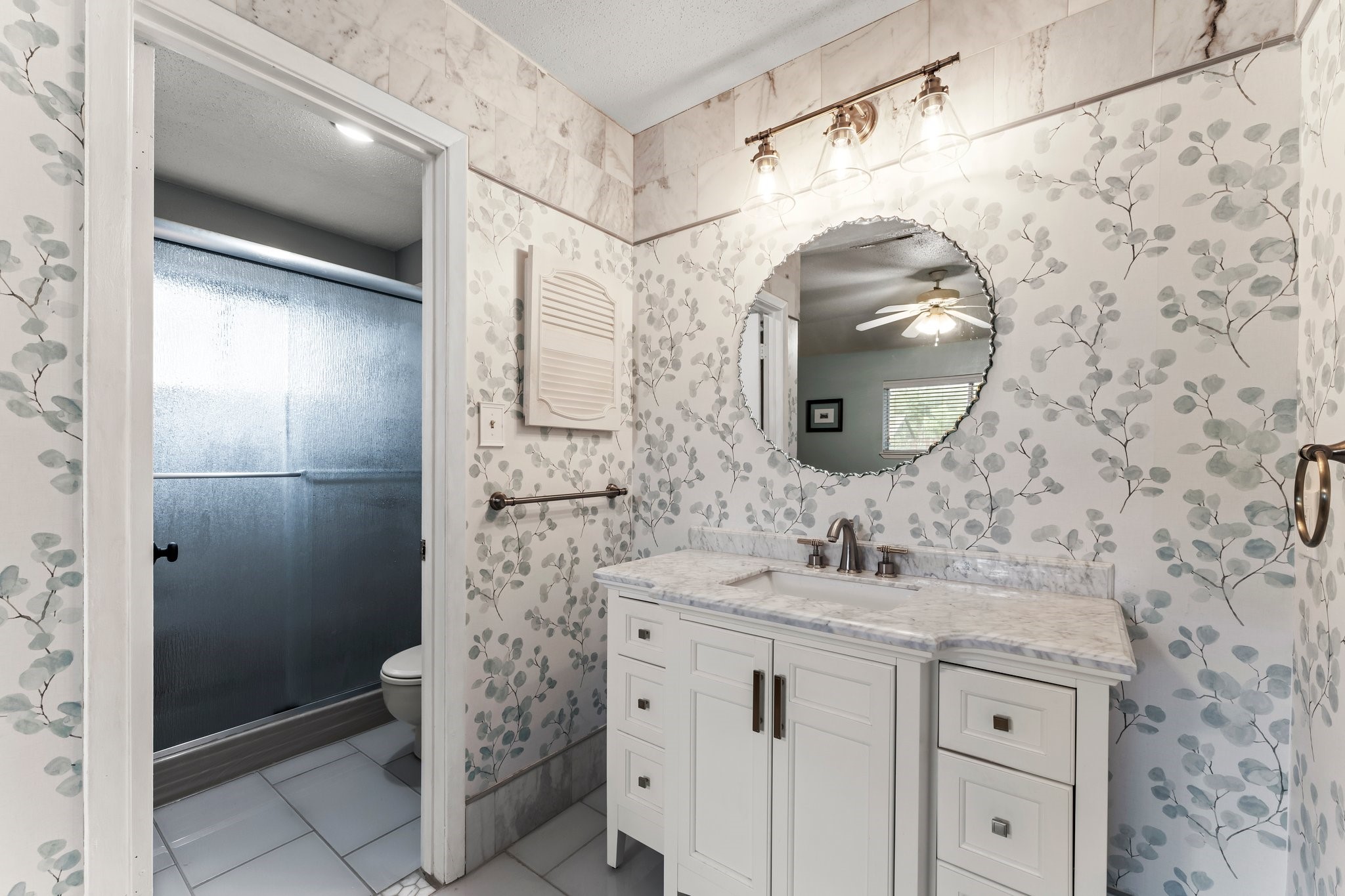 6103 Sunnygate Drive Spring, TX 77373 - Photo 14 of 25 a bathroom with a sink and a mirror
