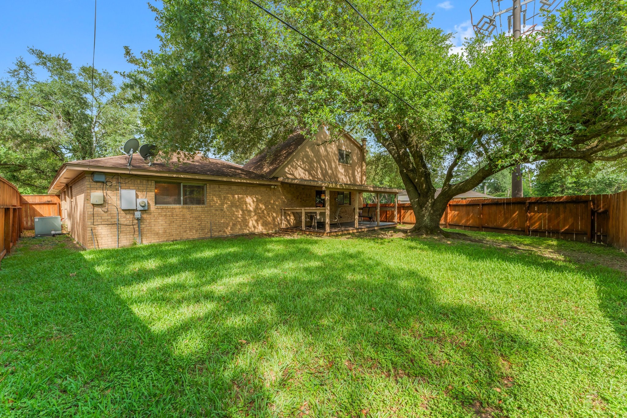 6103 Sunnygate Drive Spring, TX 77373 - Photo 24 of 25 a view of a house with a backyard