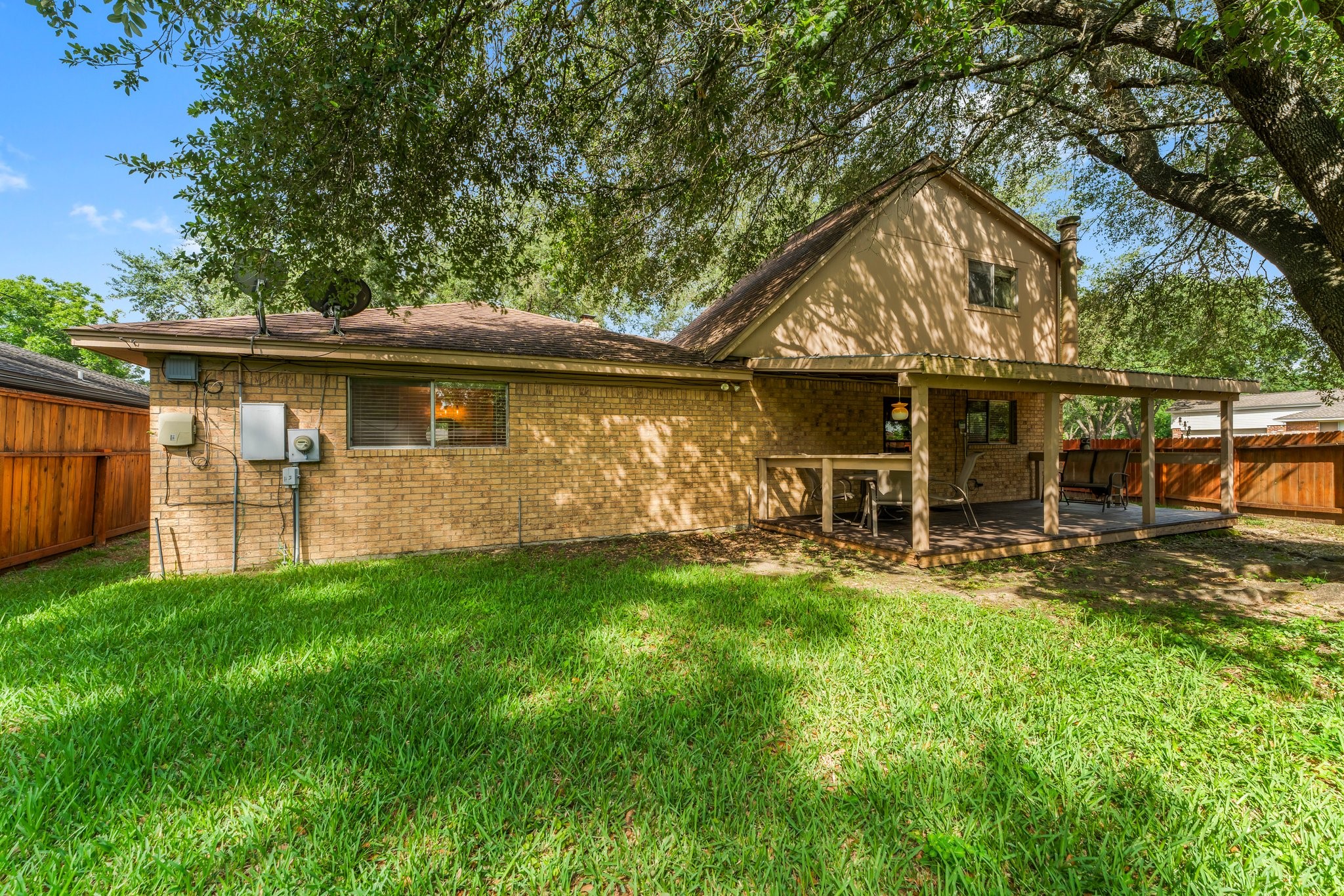 6103 Sunnygate Drive Spring, TX 77373 - Photo 25 of 25 a backyard of a house with table and chairs