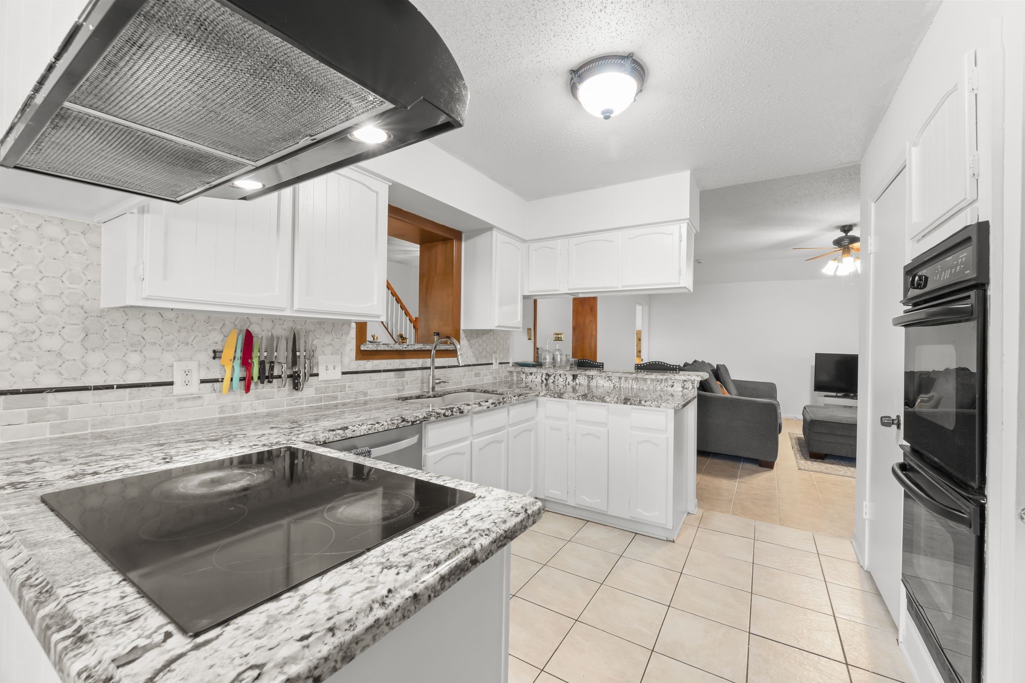 6103 Sunnygate Drive Spring, TX 77373 - Photo 7 of 25 a kitchen with a sink cabinets and appliances
