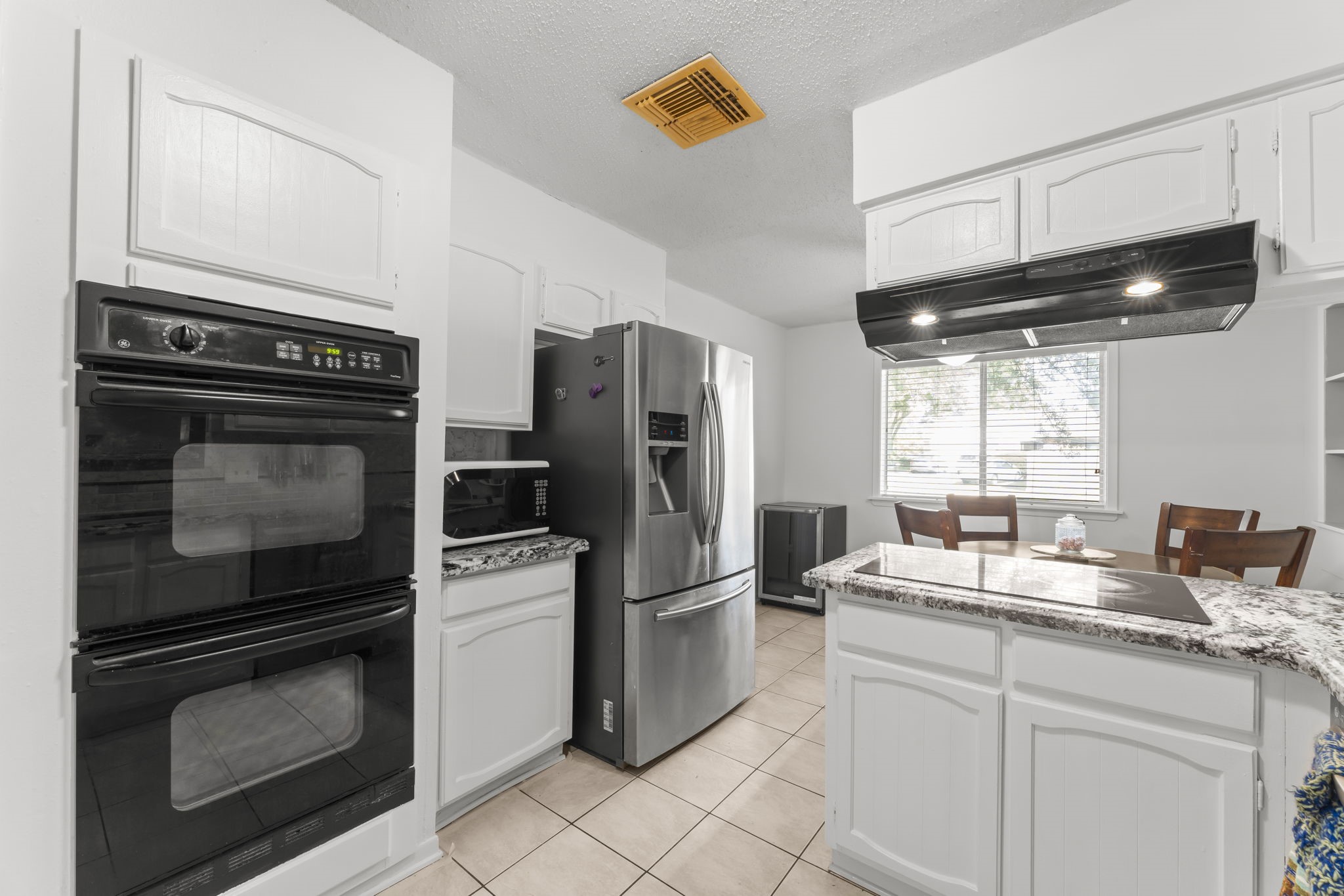 6103 Sunnygate Drive Spring, TX 77373 - Photo 8 of 25 a kitchen with appliances and cabinets
