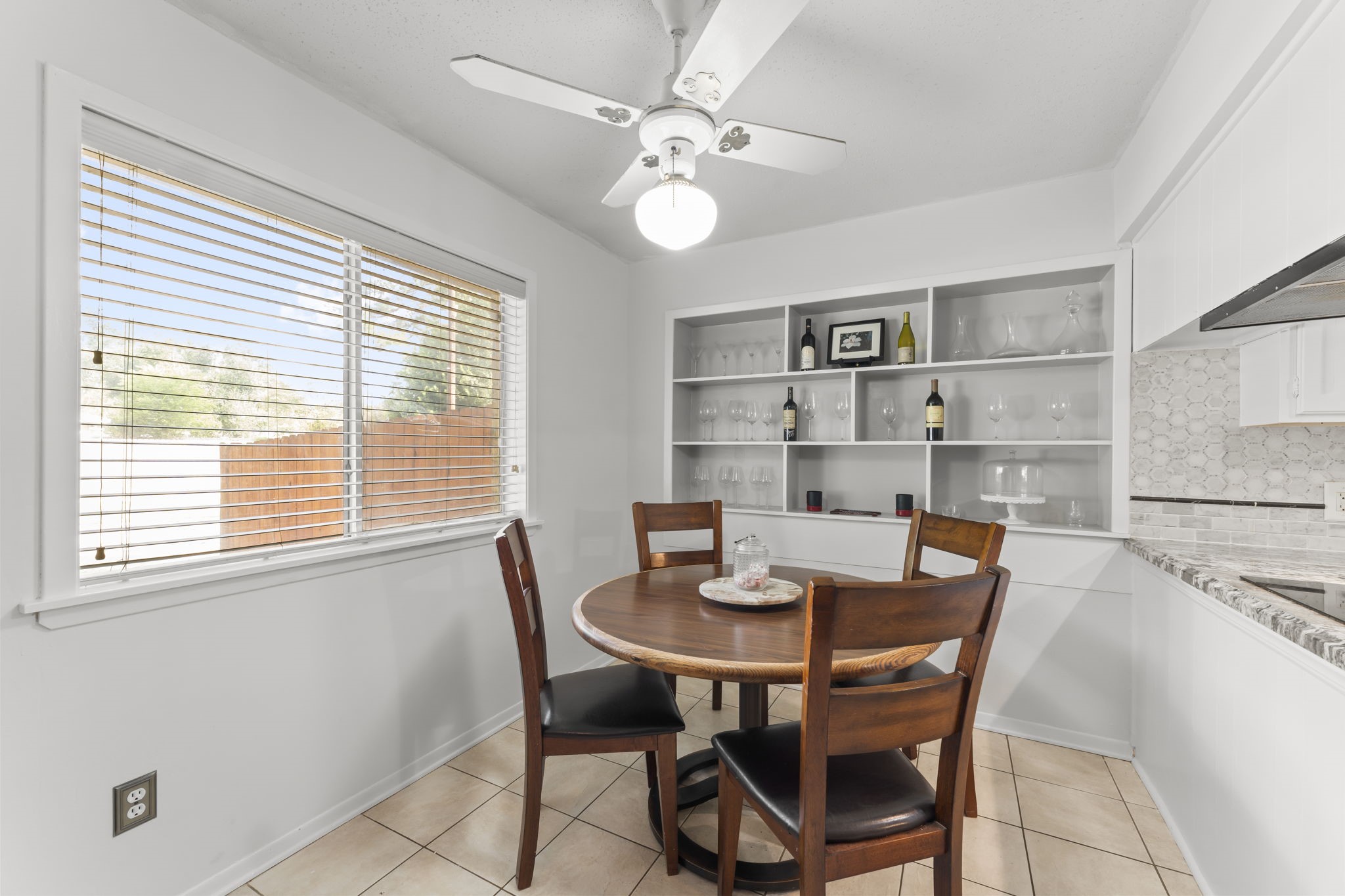 6103 Sunnygate Drive Spring, TX 77373 - Photo 9 of 25 a view of a dining room with furniture and a window