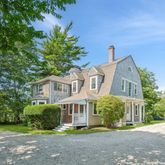 a view of a house with a yard and plants