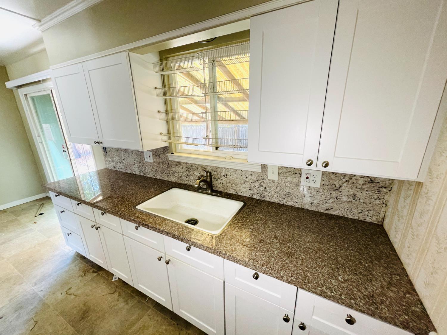 2115 Ruby Court Sacramento, CA 95821 - Photo 17 of 17 a kitchen with a sink stove and cabinets