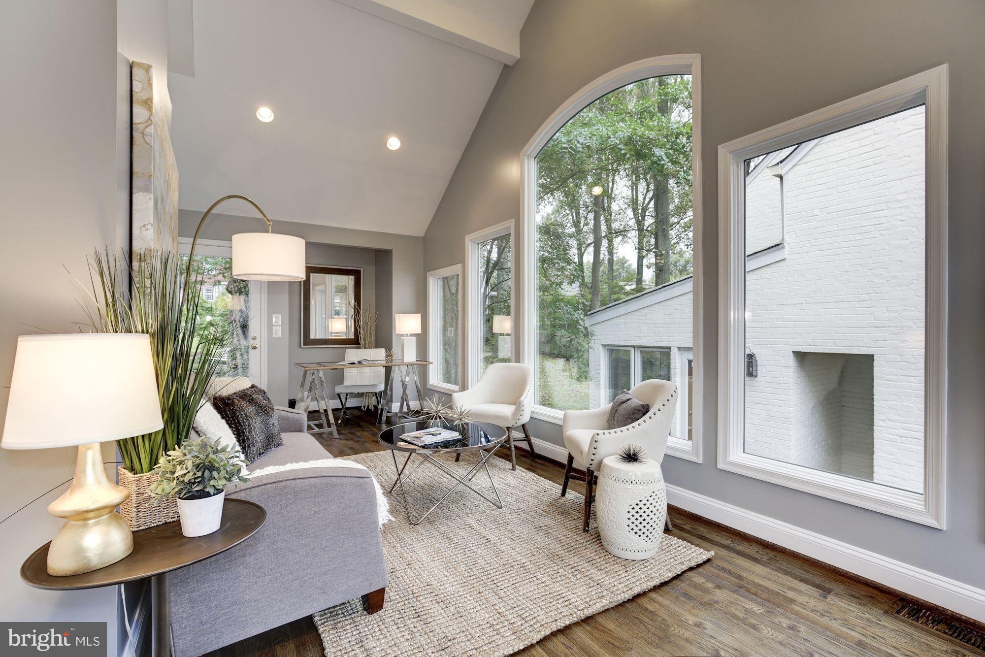 4814 Sedgwick Street Northwest Washington, DC 20016 - Photo 11 of 30 a living room with furniture and a large window