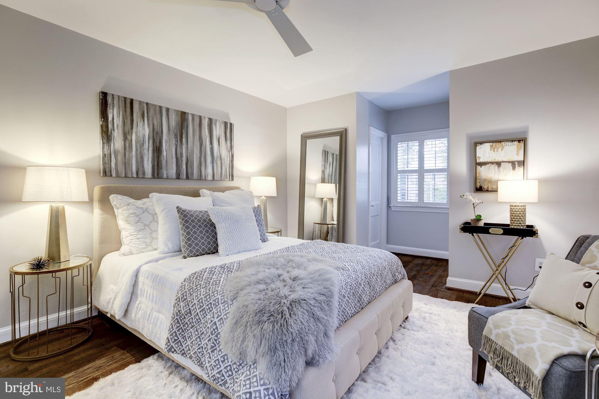 4814 Sedgwick Street Northwest Washington, DC 20016 - Photo 13 of 30 a bedroom with a bed and wooden floor