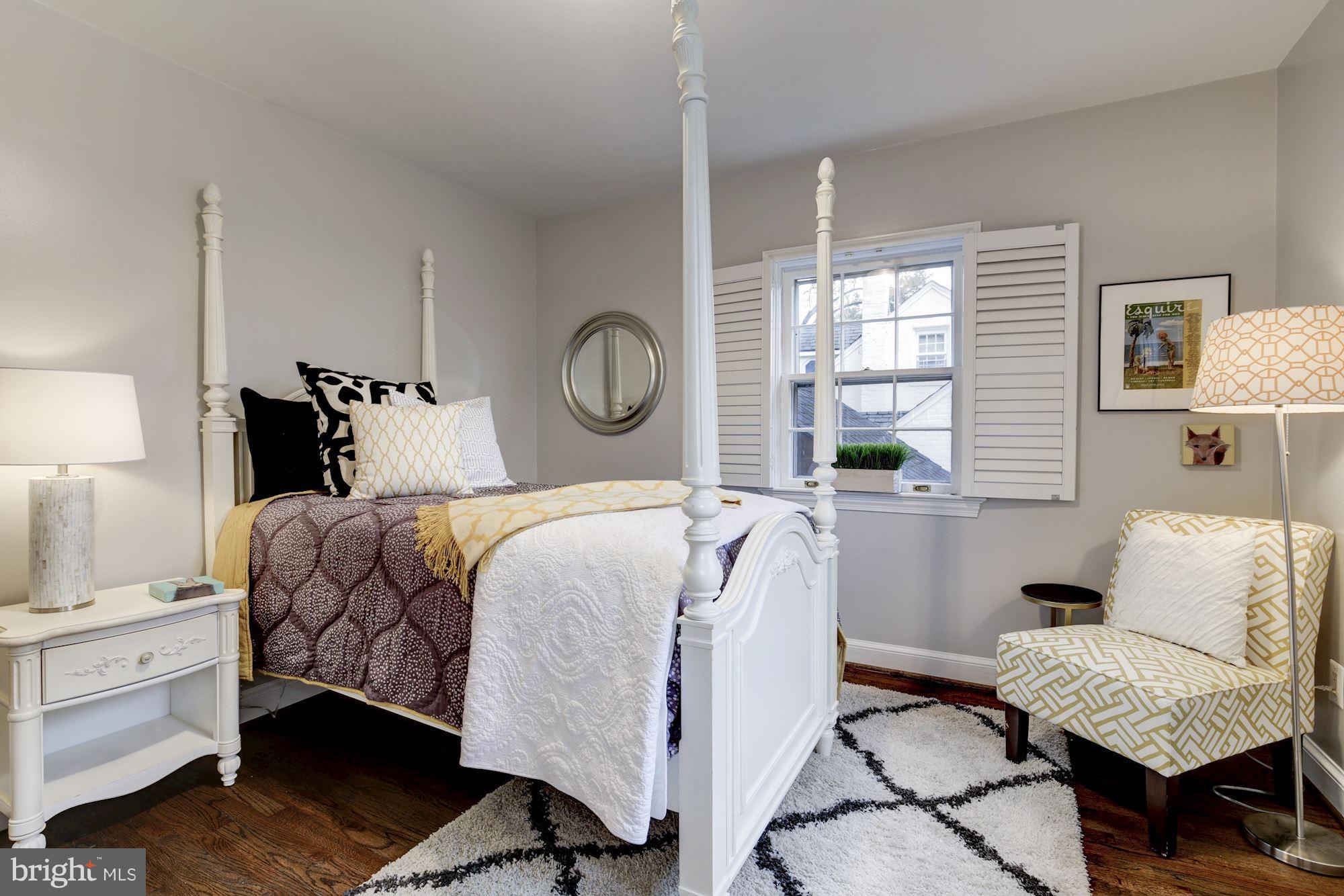 4814 Sedgwick Street Northwest Washington, DC 20016 - Photo 17 of 30 a bedroom with a large bed and a window