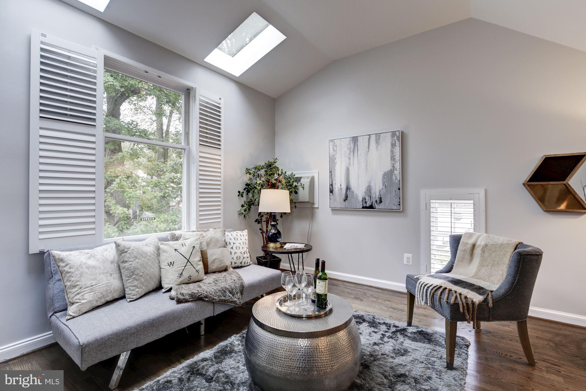4814 Sedgwick Street Northwest Washington, DC 20016 - Photo 19 of 30 a living room with furniture and a large window