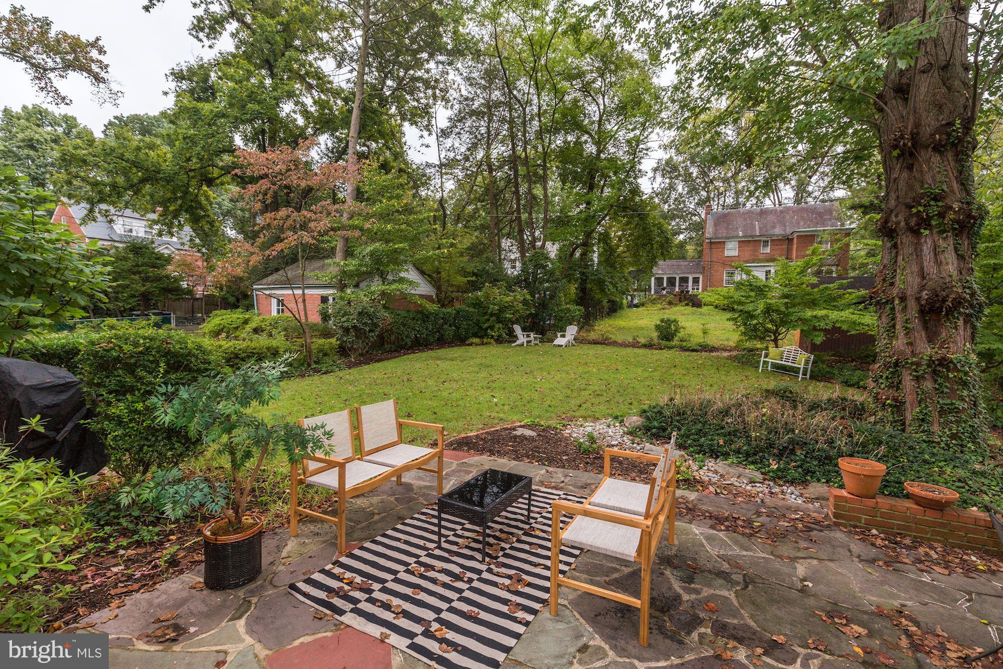4814 Sedgwick Street Northwest Washington, DC 20016 - Photo 24 of 30 a view of a chairs and table in backyard