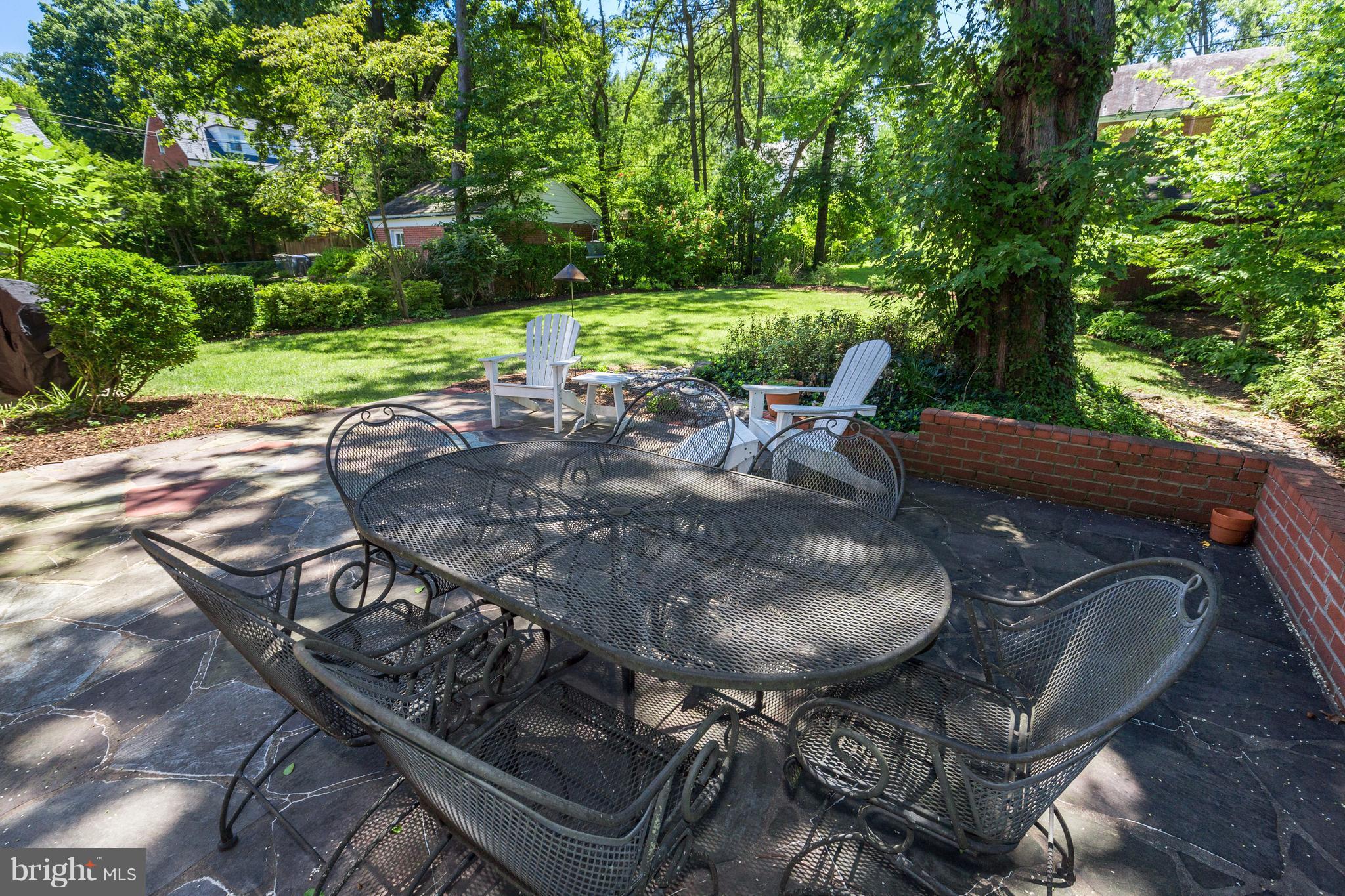 4814 Sedgwick Street Northwest Washington, DC 20016 - Photo 25 of 30 a view of a backyard with chairs and table