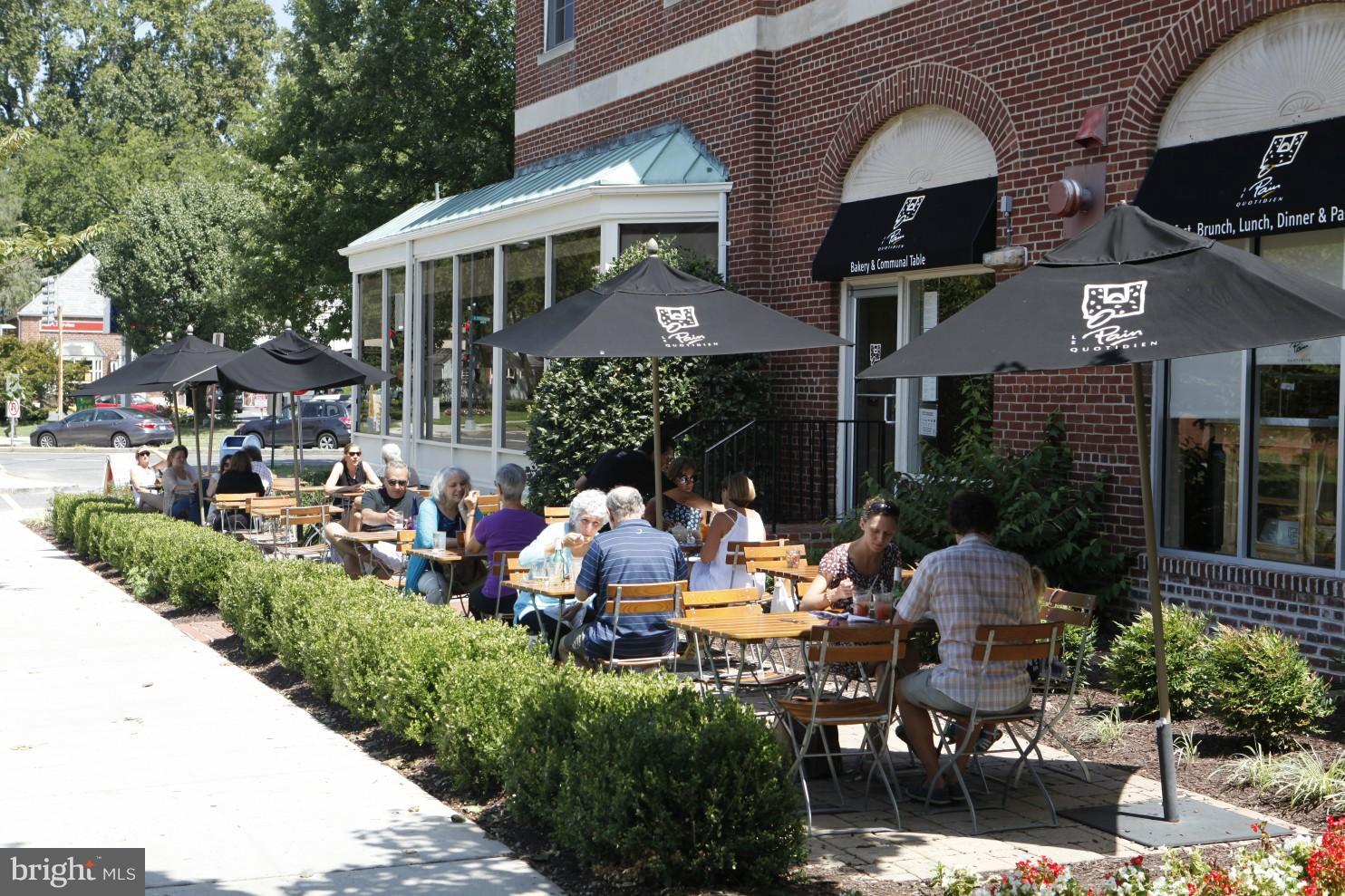 4814 Sedgwick Street Northwest Washington, DC 20016 - Photo 26 of 30 a group of people sitting in front of a house