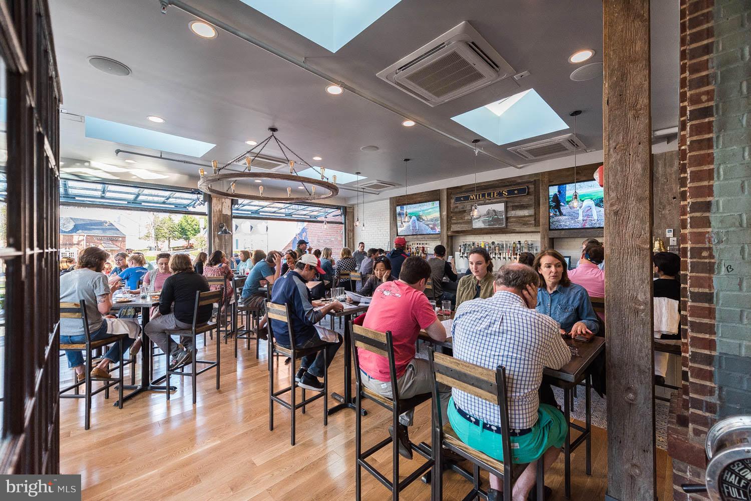 4814 Sedgwick Street Northwest Washington, DC 20016 - Photo 28 of 30 a group of people sitting in a room