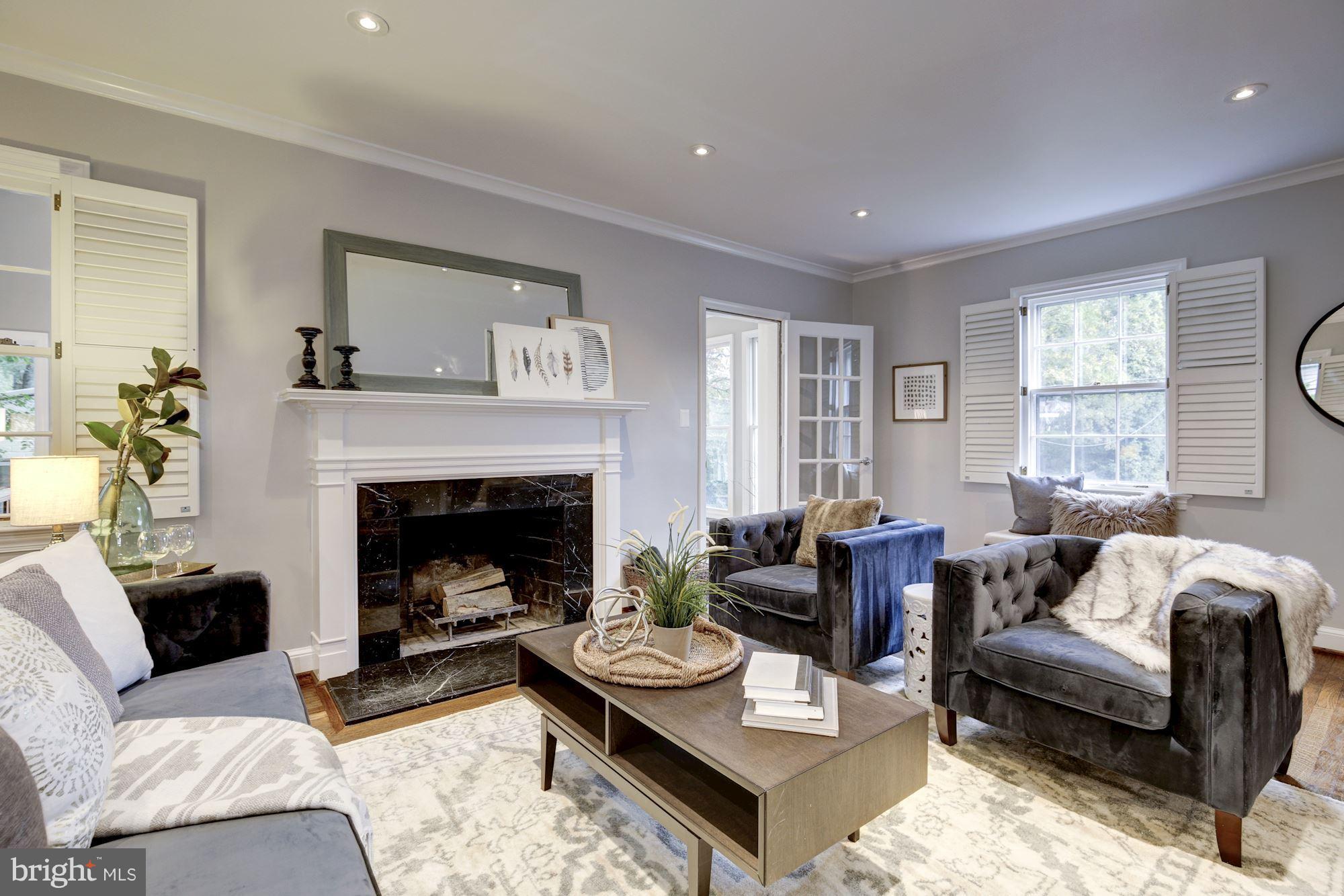 4814 Sedgwick Street Northwest Washington, DC 20016 - Photo 9 of 30 a living room with furniture and a fireplace