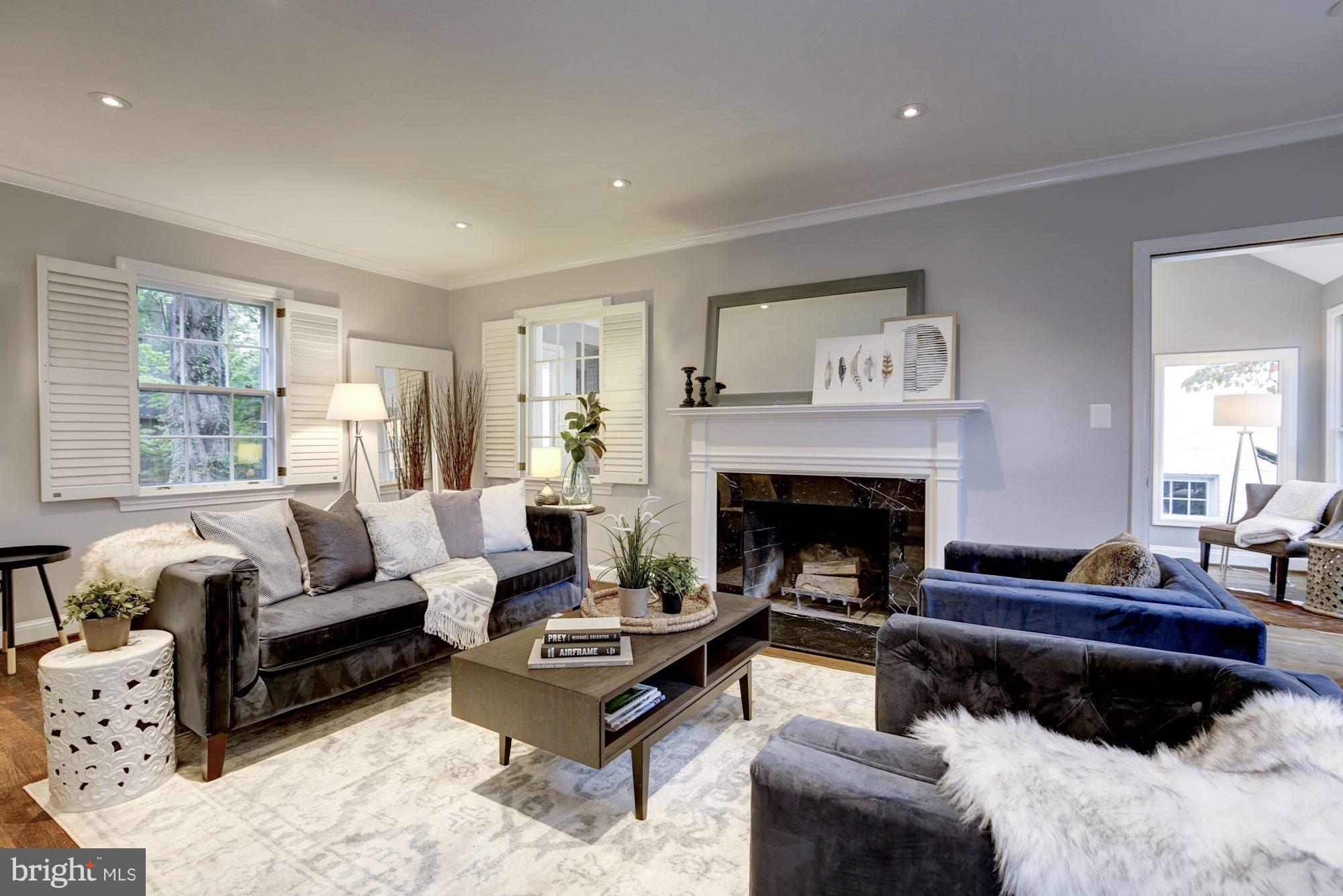4814 Sedgwick Street Northwest Washington, DC 20016 - Photo 10 of 30 a living room with furniture and a fireplace