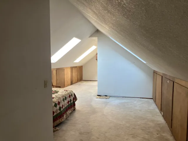 a view of bedroom with bed and window