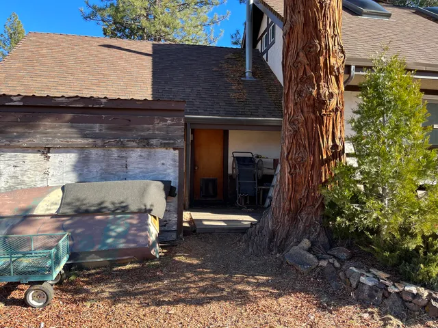 a view of a brick house with a small park