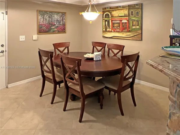 a view of a dining room with furniture