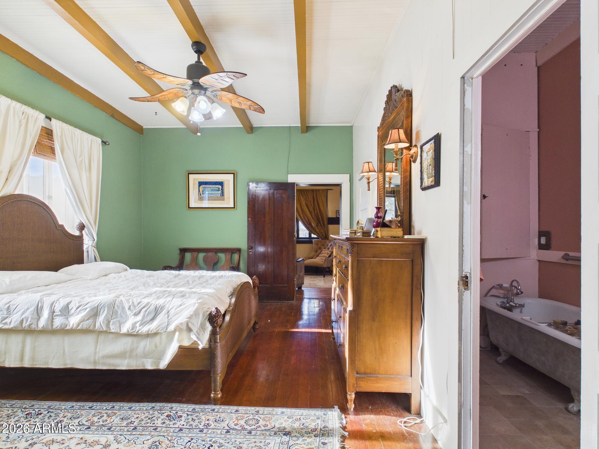 198 4th Street Clifton, AZ 85533 - Photo 11 of 30 a bedroom with a bed and wooden floor
