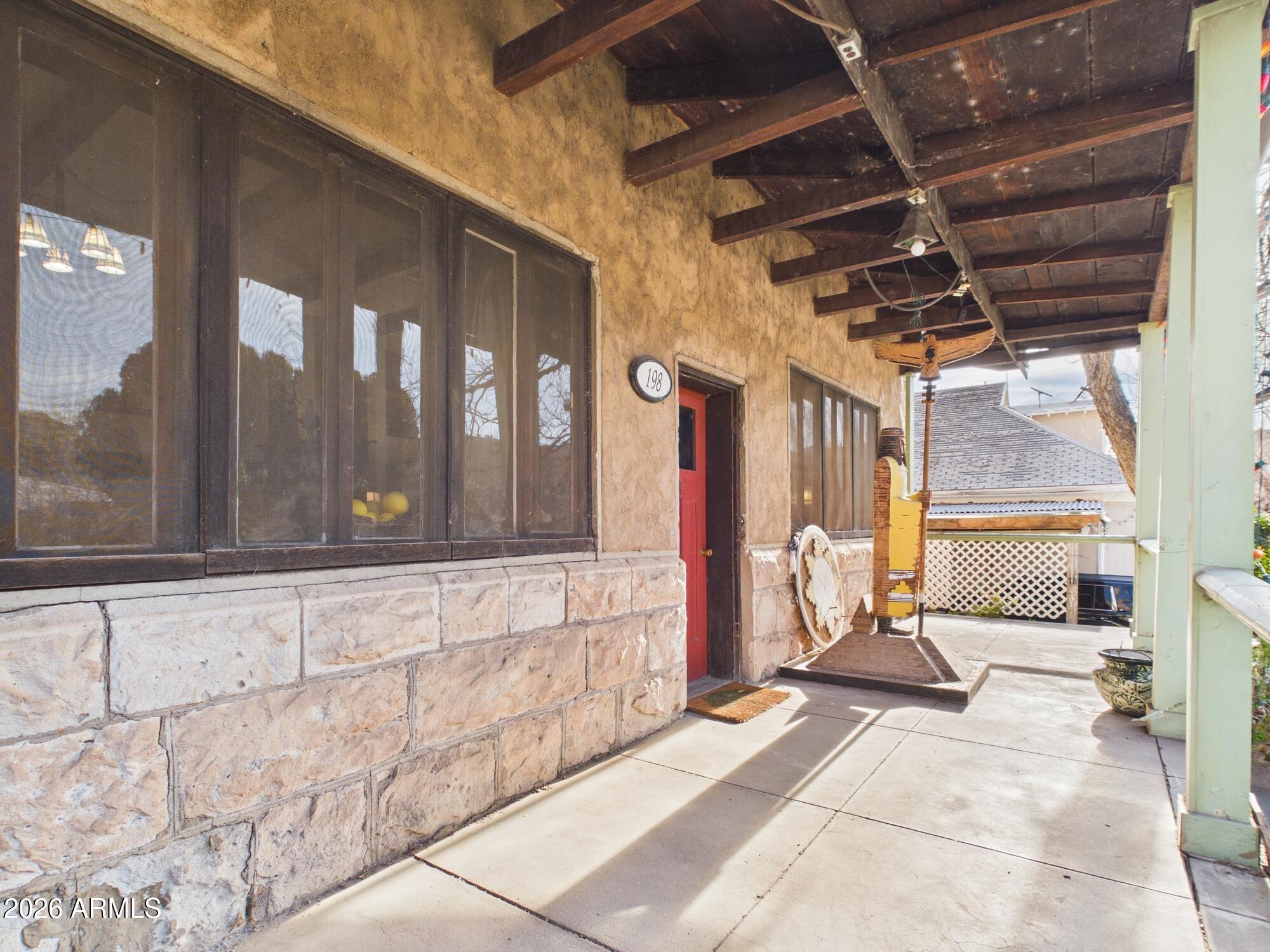 198 4th Street Clifton, AZ 85533 - Photo 2 of 30 a living room with a large window and furniture