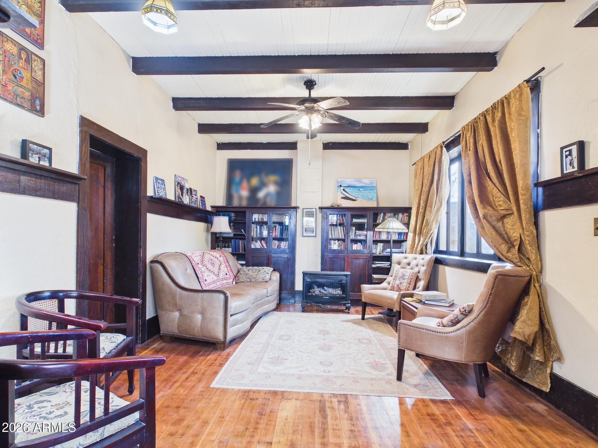 198 4th Street Clifton, AZ 85533 - Photo 5 of 30 a living room with furniture a rug and a window