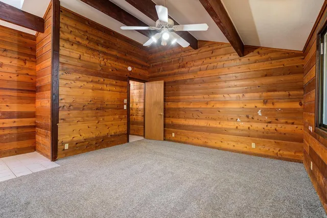 a view of walk in closet and window