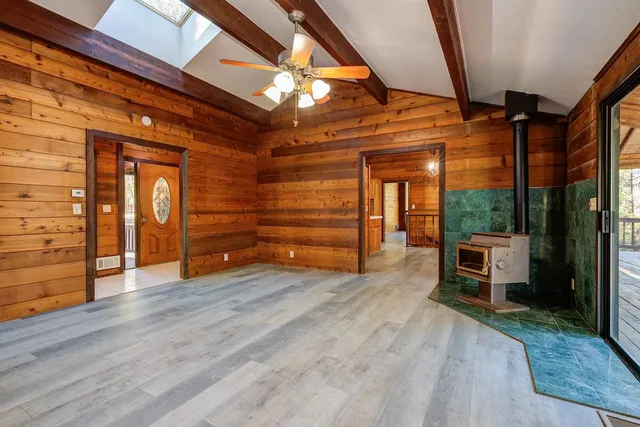 wooden floor in an empty room with a fireplace