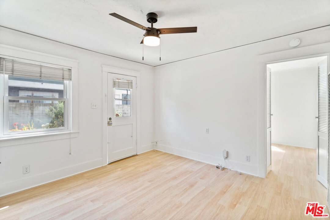 1747 9th Street Santa Monica, CA 90404 - Photo 12 of 24 a view of empty room with wooden floor and fan