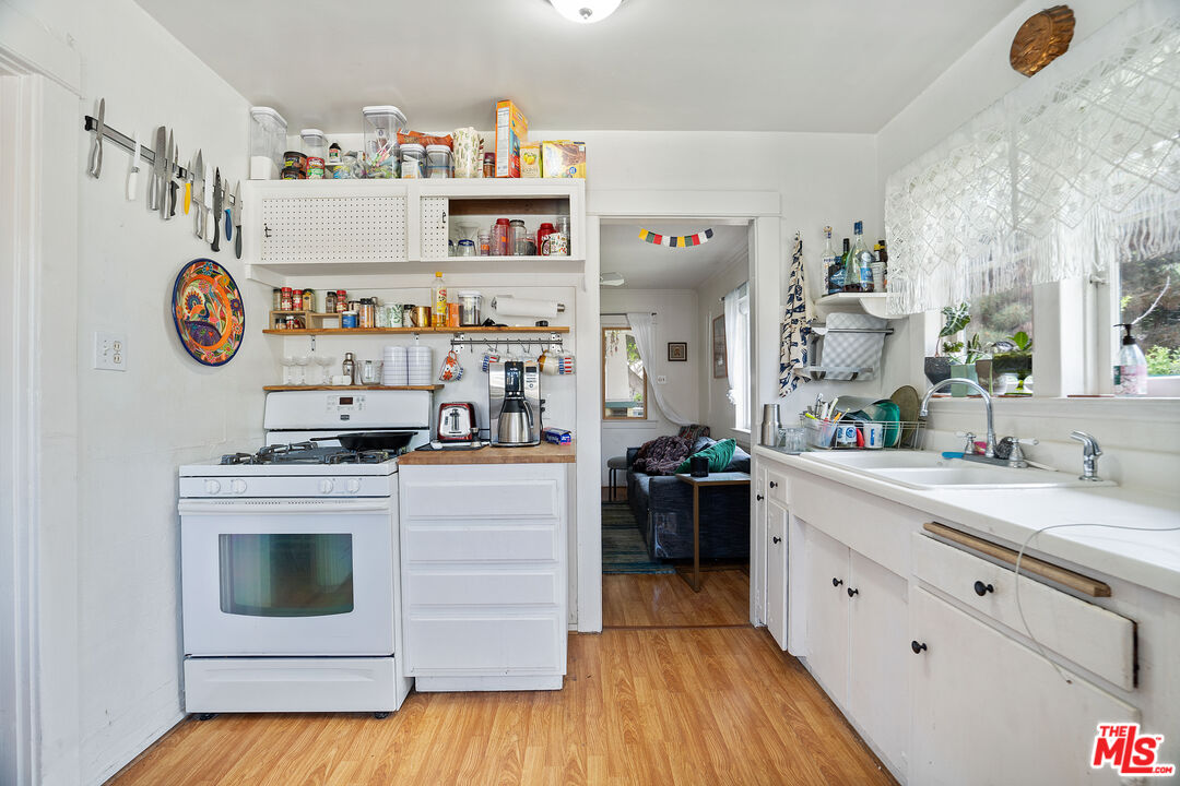 1747 9th Street Santa Monica, CA 90404 - Photo 7 of 24 a kitchen with a stove and cabinets