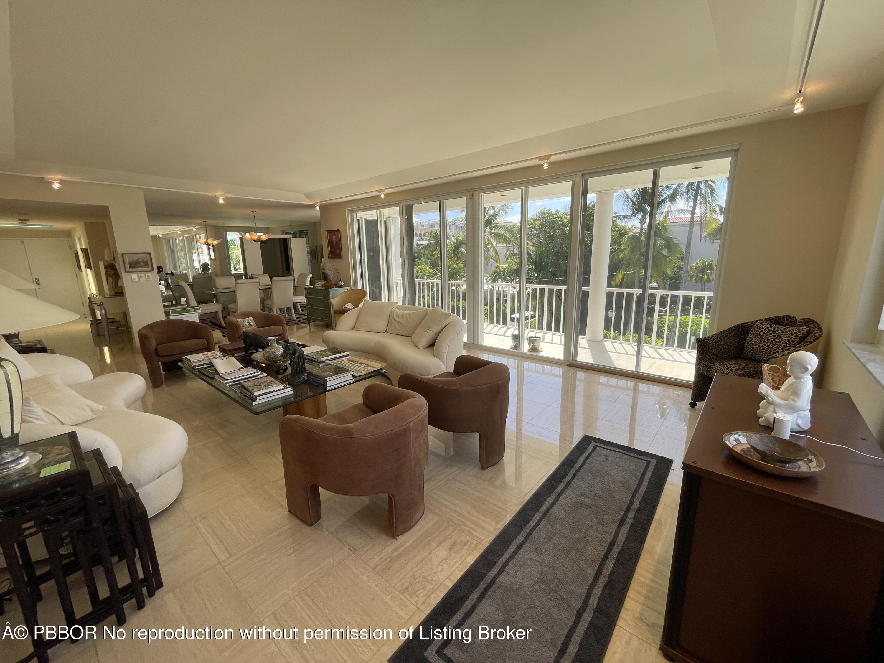 145 Peruvian Avenue, Unit 3010 Palm Beach, FL 33480 - Photo 14 of 18 a living room with furniture and a floor to ceiling window